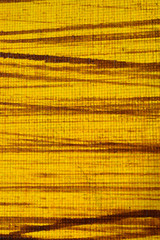  Abstract yellow background with brown lines. Vertical image.