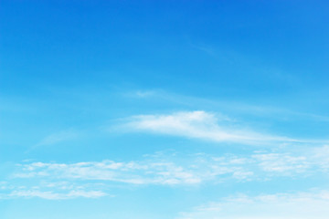 Wall Mural - soft white clouds against blue sky background and empty space for your design