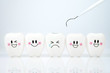 © Phawat - Teeth smile and crying emotion with dental plaque tool ,Concept Dental care cleaning bacterial plaque on white background