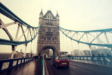 Fototapeta Londyn - Blurred photo of London traffic at rush hour on Tower Bidge, London, UK
