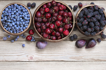 Wall Mural - Assorted berries in bowls