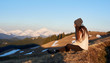 © anatoliy_gleb - Shot of a woman admiring stunning view sitting on top of a mountain copyspace peace nature harmony lifestyle active sportive healthy relaxing resting meditative