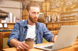 © Africa Studio - Handsome young man working on computer at cafe