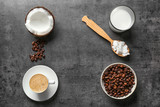Fototapeta Mapy - Cup of tasty coconut coffee, nut and spoon with butter on table