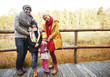 © gpointstudio - Family posing on wooden bridge