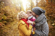 © gpointstudio - Joyful scene of parents kissing daughter
