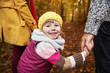 © gpointstudio - Smiley girl holding parents hands
