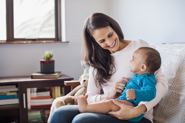 Wall Mural - Baby on mother lap