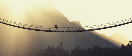 man with backpack on a rope bridge