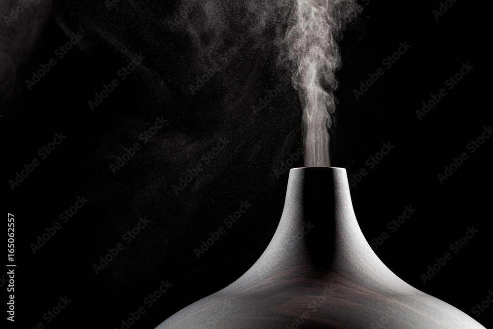 Close up of an ultrasonic aromatherapy oil diffuser in use. - obrazy, fototapety, plakaty 