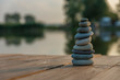Zen Balancing Pebbles Next to a Misty Lake