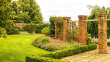 Brick Pillars Within A Walled Garden
