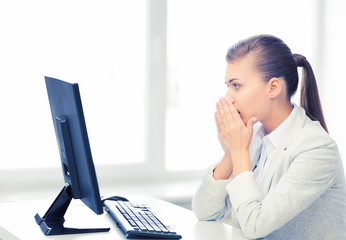 Wall Mural - stressed student with computer in office