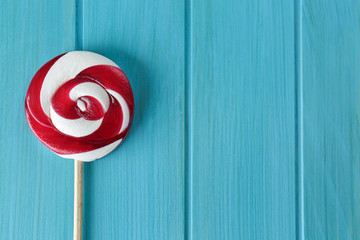 Sticker - Tasty colorful candy on wooden background