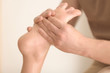 © Africa Studio - Young woman having foot massage in spa salon, closeup