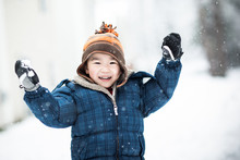 Asian Boy Playing Snow Outdoor In Winter
