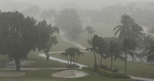 A Tropical Rain Storm Soaks A Golf Course Fairway In Miami Florida USA