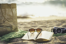 Various Object Lying On The Beach Sand