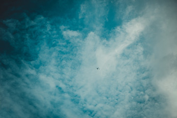 small white airplanes on the far away sky..