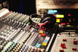 © rolfo/Stocksy - Buttons of a professional audio recording studio