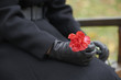 © Craig Holmes/Stocksy - Woman in mourning at a funeral