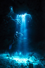 Wall Mural - Sunbeam into the underwater cave