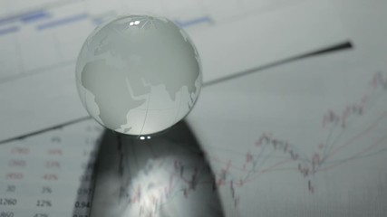 Wall Mural - Glass globe with stock charts