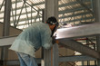 © nikonlike - Man weld a metal with a welding machine.