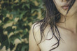 © EKerkman Photography/Stocksy - Young asian woman with wet hair on her shoulder.