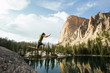© Carl Zoch/Stocksy - Male cliff jumping in the Sawtooth Mountains, Idaho