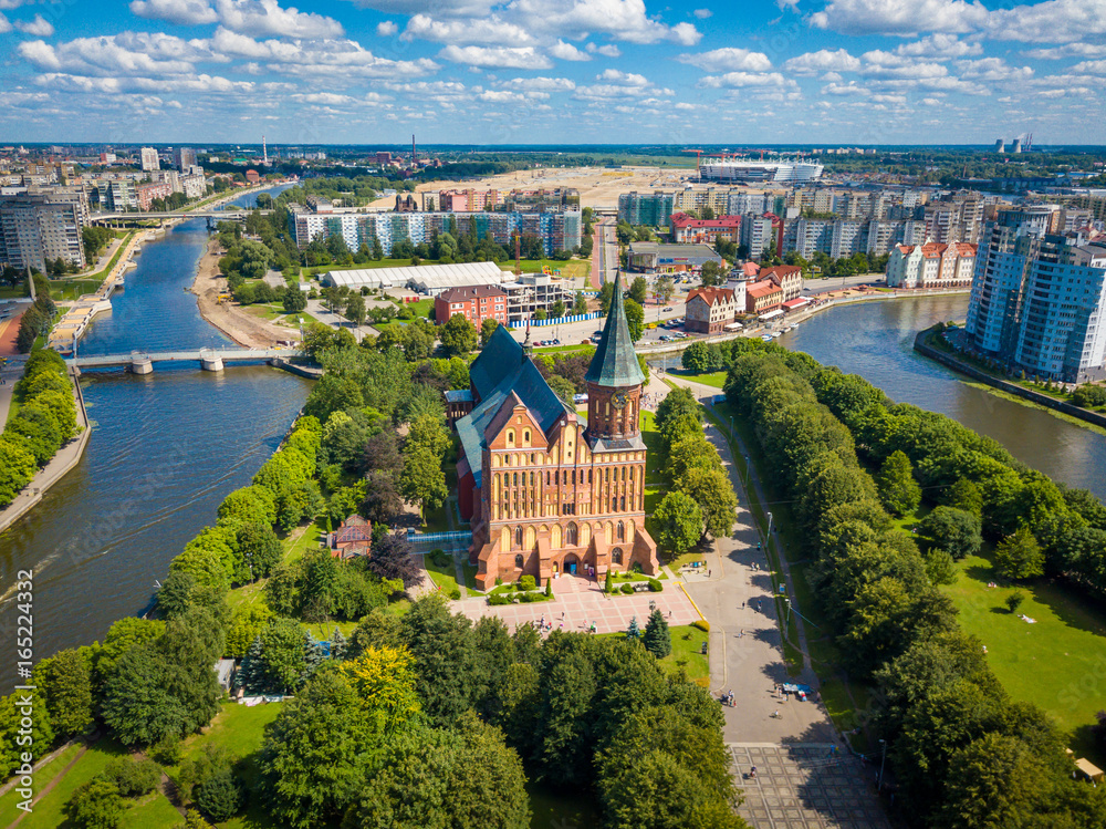 Aerial cityscape of Kant Island in Kaliningrad, Russia at sunny summer day with white clouds in the blue sky - obrazy, fototapety, plakaty 