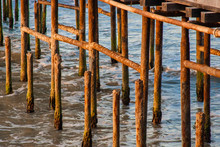 Ocean and rusty dock pilllars