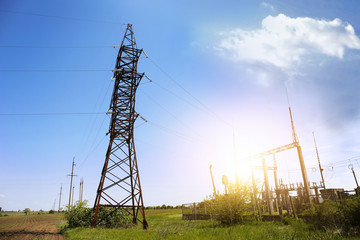 High voltage tower on blue sky background