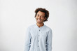 © wayhome.studio  - Indoor portrait of cheerful playful young Afro American man in good mood flirting, smiling broadly and winking at camera. Positive human facial expressions, emotions, feelings, attitude and reaction