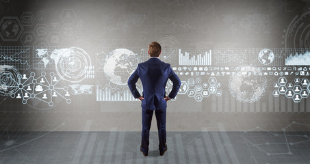 Poster - Businessman using graph screens interface on a wall 3D rendering