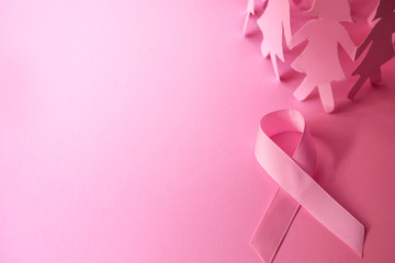 Wall Mural - Sweet pink ribbon shape with the girl paper doll on pink background  for Breast Cancer Awareness symbol to promote  in october month campaign