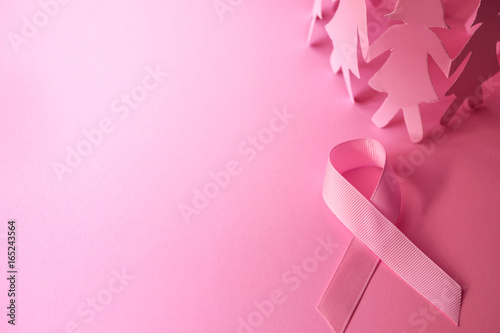 Cuadros en Lienzo Sweet pink ribbon shape with the girl paper doll on pink background for Breast