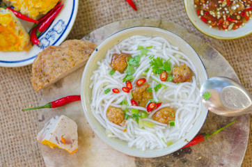 Wall Mural - Banh Canh - one of most popular soup noodle in the seaside area with rice noodle, grilled fish, green onion and fish sauce...