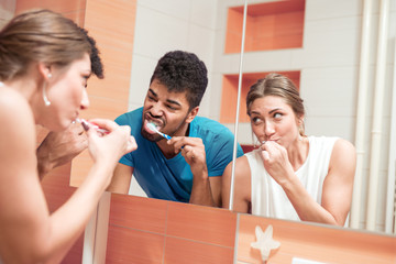 Bathroom routine for happy young couple.