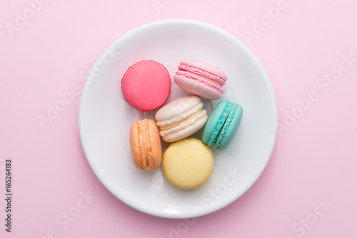 Cuadros en Lienzo Colorful pastel cake macaron or macaroon on plate.