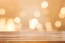 Empty Wooden Table And Blur  Shiny Bokeh Gold Background