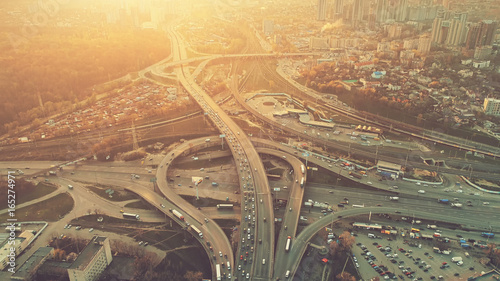 Fotografía Aerial Drone Flight View of freeway busy city rush hour heavy traffic jam highway