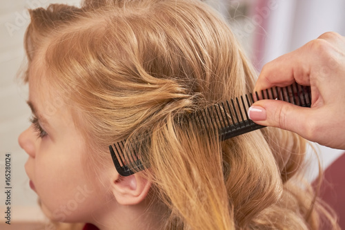 Hand Brushing Hair Of Child Hairdo Of Little Girl Macro Buy