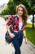 © F8  \ Suport Ukraine - Summer sunny lifestyle fashion portrait of young stylish hipster woman walking on street  with backpack