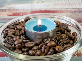 Wall Mural - Still life of candles  and coffee beans on wooden  background