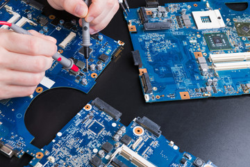 Poster - Laptop motherboard testing in service center