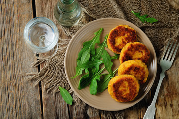 Potato pumpkin burgers with arugula