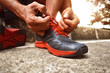 © fotokitas - Man tying running shoes