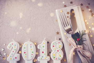 Wall Mural - Happy New Year 2018 table place setting, holidays copy space fairy light toning background