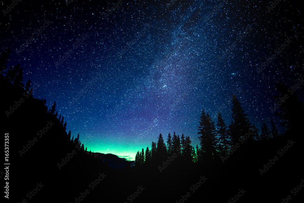 Star gazing the Aurora Borealis at Moraine Lake in Banff National Park - obrazy, fototapety, plakaty 
